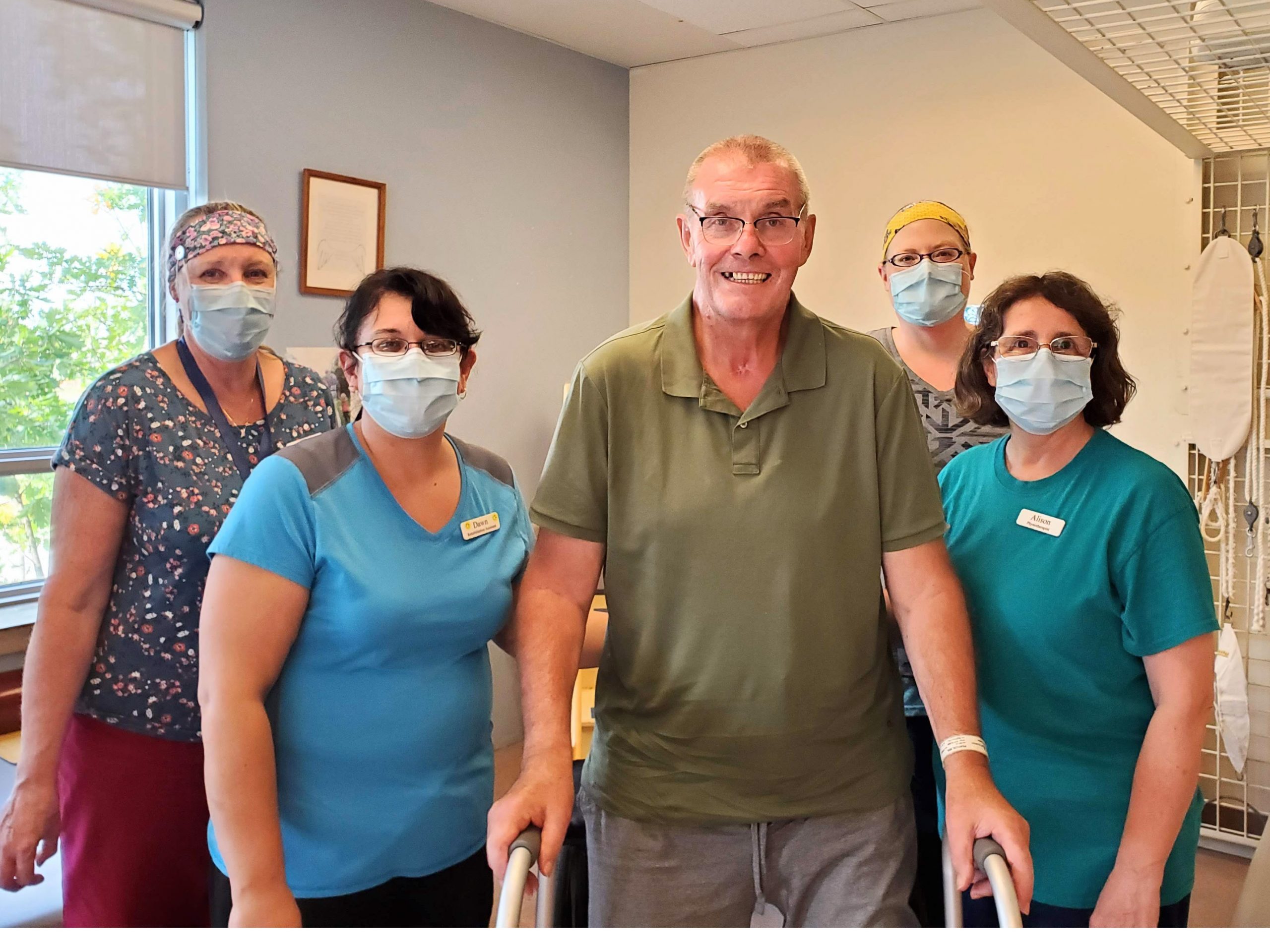 Photo, left to right: Lorna Bogar, Occupational Therapist; Dawn McNeil, Rehab Assistant; Neil Pearson; Ange Allard, Rehab Assistant; Alison Rees, Physiotherapist.