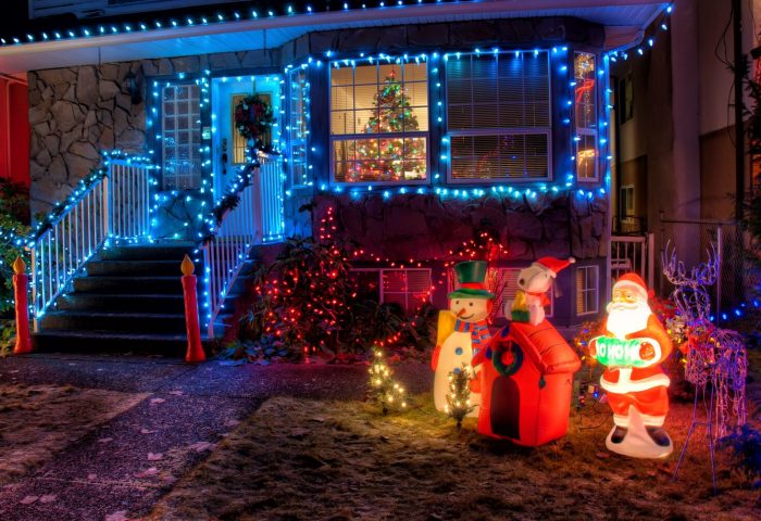 Exterior of a home covered in Christmas lights and decorations