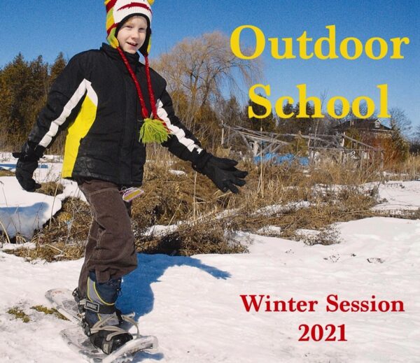 Child on snow shoes smiles and walks towards a camera. On the left of him the poster reads "Outdoor School" and "Winter Session 2021"