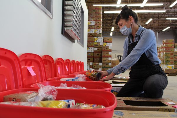 Amelia Boyd, Community Program Coordinator of KLFS packing the first round of meal kits for participants of the Family Cooking Project