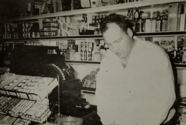Ross Fisher Sr. at the counter of Fisher's Grocery Store in January of 1956. Photo courtesy of Wally Nugent.