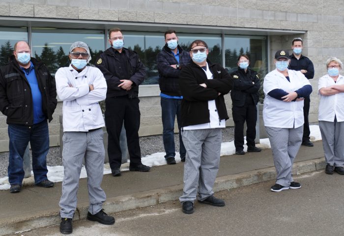 Nine union members standing outside of the Central East Correctional Facility in Lindsay ON